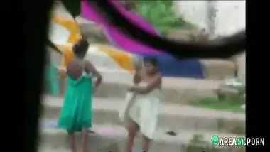 Local guy caught sexy Indian aunts take a bath outdoor in the river. Hidden camera desi